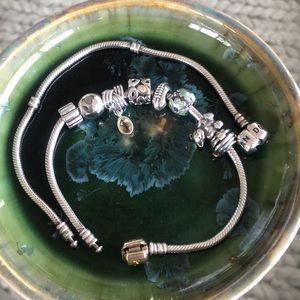 Two tone Pandora bracelet with charms.